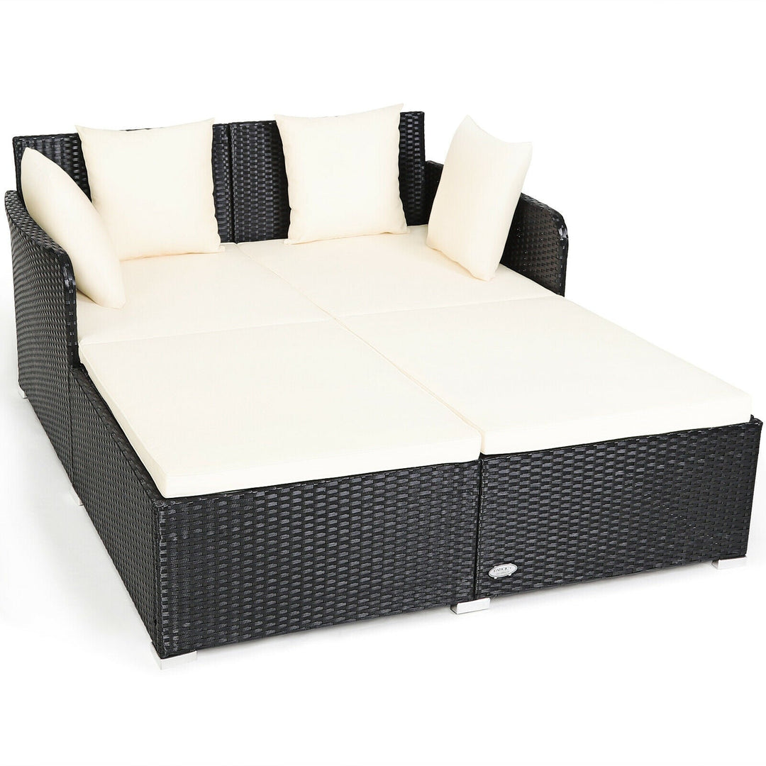 Spacious Outdoor Rattan Daybed with Upholstered Cushions and Pillows