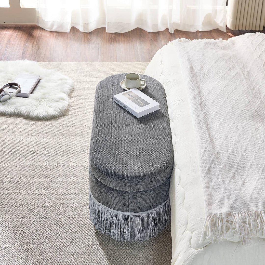 Oval Upholstered Storage Ottoman with Fringe Trim, 39.4"