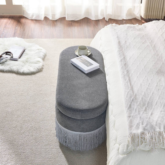Oval Upholstered Storage Ottoman with Fringe Trim, 39.4"