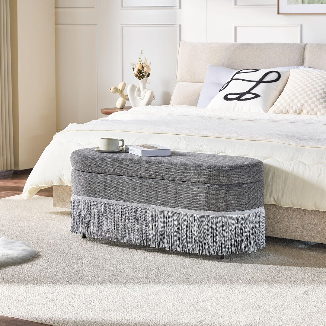 Oval Upholstered Storage Ottoman with Fringe Trim, 39.4"