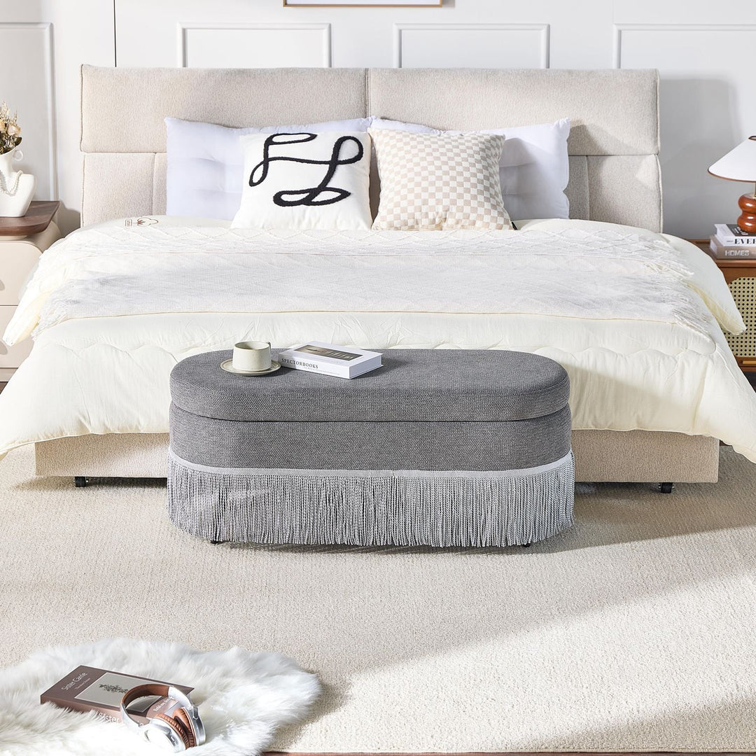 Oval Upholstered Storage Ottoman with Fringe Trim, 39.4"